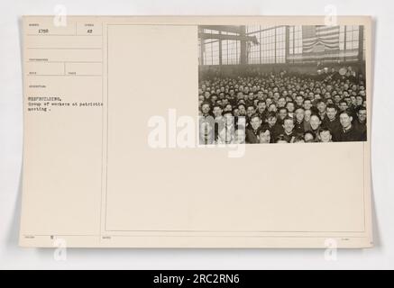A group of workers gathered for a patriotic meeting during shipbuilding activities. The workers appear to be engaged in discussions and planning related to their work on ships. Stock Photo