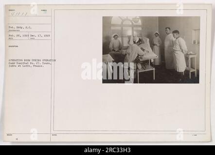 Pvt. Eddy in the operating room during a surgery at Camp Hospital No. 27 in Tours, Indre et Loire, France. The photo was taken between February 26, 1919, and December 17, 1918. Number on the back of the photo is 111-SC-41111. Stock Photo