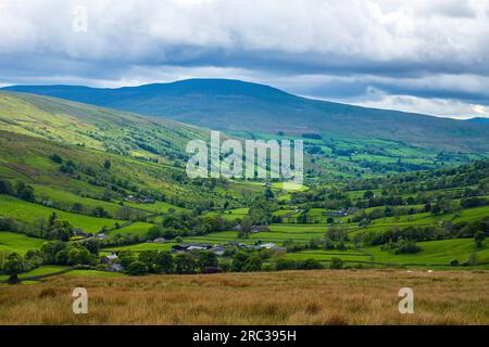 The view looking down Dentdale in the Yorkshire Dales, Cumbria, on a bright but not sunny May day from near Dent Station Stock Photo