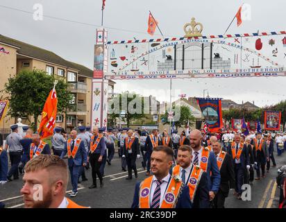 Lurgan, County Armagh, Northern Ireland.12 Jul 2023. The Twelfth of July is marked by Orange Order parades across Northern Ireland. Lurgan District left their headquarters at Brownlow House before parading up the town to the war memorial ahead of the main County Armagh demonstration being held in the town this year.The parades across Northern Ireland mark the victory of William of Orange over James at the Battle of the Boyne in 1690. Credit: CAZIMB/Alamy Live News. Stock Photo