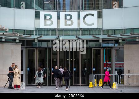 London, UK.  12 July 2023.  People outside the headquarters of the BBC at Portland Place.  The Sun newspaper has alleged that a BBC presenter paid a young person for explicit photos, beginning when they were 17.  The BBC has suspended, but not yet publicly identified the male presenter as investigations continue.  Credit: Stephen Chung / Alamy Live News Stock Photo