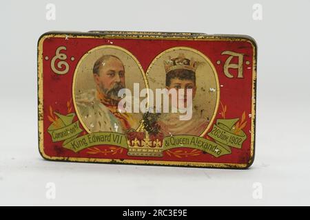 A tin containing Cadbury's chocolates, made to celebrate the coronation of King Edward VII and Queen Alexandra on June 26, 1902, before they go up for sale by auction at Hanson's Auctioneers in Etwal, Derbyshire, with a guide price of £100-£150. The special tin of Cadbury's vanilla chocolates was given to nine-year-old Mary Ann Blackmore by her Durham school and and treasured them as a memento of an important royal occasion for her entire life, until her death at the age of 96 in 1988. Picture date: Wednesday July 12, 2023. Stock Photo