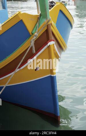 The eye of Osiris on the prow of a characteristic luzzu, the symbol of Malta, in the port of Marsaxlokk Stock Photo