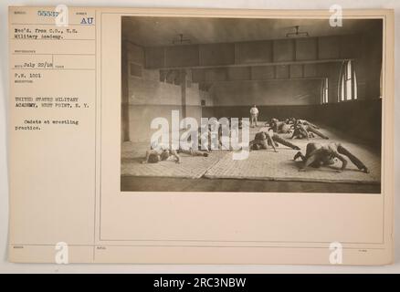 Image depicting cadets at the United States Military Academy in West Point, New York engaging in wrestling practice. This photograph was taken on July 22, 1918 and assigned the identification number 55537 Re'd. The description matches the scene captured in the picture. Stock Photo