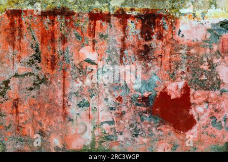 Old wall, peeling orange paint colorful texture Stock Photo