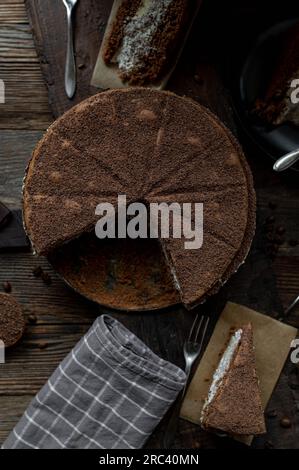 Chocolate cake on a rustic wooden background. Top view. Stock Photo