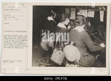 American telephone girls, members of the U.S. Signal Corps, played a crucial role in the capture of St. Mihiel. Despite being within range of German shell fire, their efficiency contributed to the success of the American troops. Gas masks and helmets were always at hand for emergencies. Photo taken Oct. 15, 1918. Passed by A.E.F. censor, Oct. 5, 1918. Stock Photo