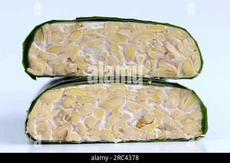 a slice of raw tempeh or tempe ,Indonesian traditional food made from ...