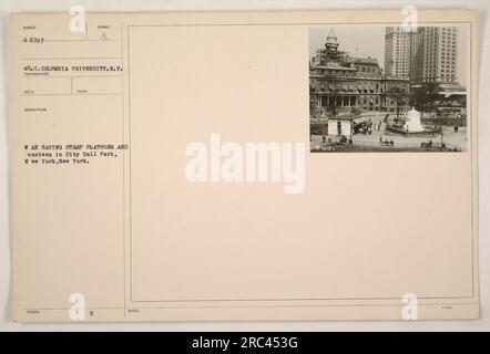 War Saving Stamp platform and canteen set up in City Hall Park, New York. The photograph was taken by the RECO photographer and is numbered 4-6727. It shows the symbol of War Saving Stamp platform and canteen in operation. The notes mention that the photograph was taken at Columbia University in New York. Stock Photo
