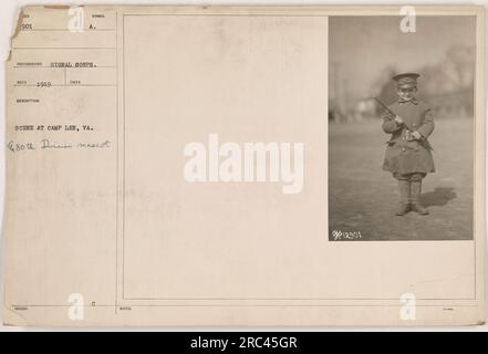 A photograph taken at Camp Lee, VA in 1919 shows the mascot of the 80th Division. The mascot is a dog and it is sitting in front of a symbol. The photo was taken by the photographer from the Signal Corps, and it has been assigned the code 111-SC-12901. Stock Photo