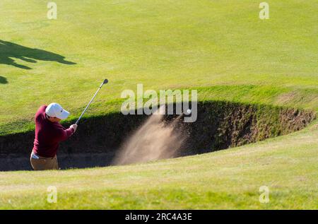 North Berwick, East Lothian, Scotland, UK. 12th July 2023. Rory McIlroy plays out of bunker at the 2nd hole at the Genesis Scottish Open at the Renaissance Club in North Berwick.  Iain Masterton/Alamy Live News Stock Photo