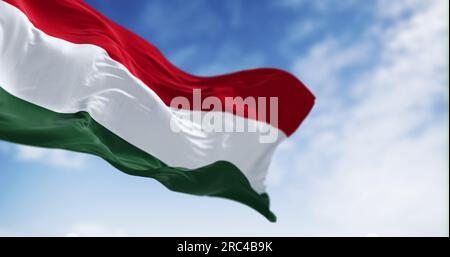 The national flag of Hungary fluttering in the wind on a clear day. Horizontal striped flag of red, white and green. 3d illustration render. Flutterin Stock Photo