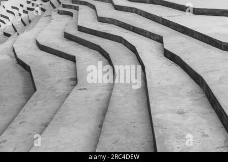 Abstract modern architecture template with gray concrete stairs in polygonal geometric shape, background photo with selective focus Stock Photo
