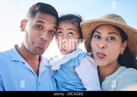 Face, family and funny with selfie on vacation for bonding with children in outdoor for travel. Silly, portrait and love and kids or parents on Stock Photo