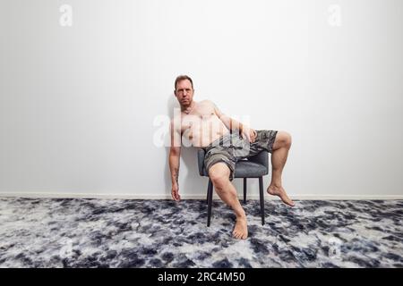 Man relaxing on chair in summer Stock Photo