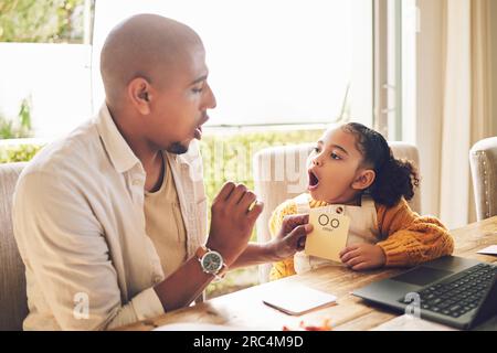 Father, teaching and girl to read for homework in home with laptop for language or knowledge. Kid, learning and english with parent for reading Stock Photo