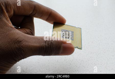 The future in your hands: close-up of a computer processor, embodying the concept of cutting-edge technology. Stock Photo