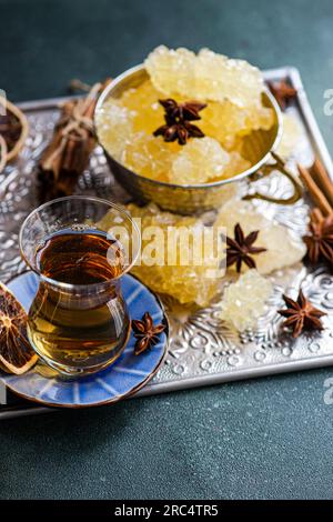Iranian crystal rock candy and spices in the vintage metal cup Stock Photo