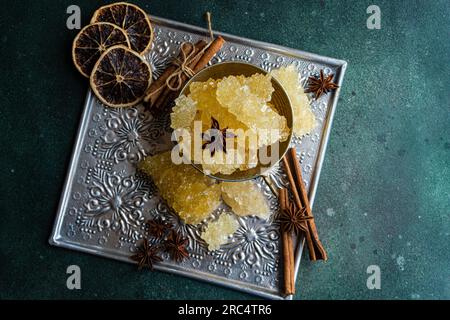 Iranian crystal rock candy and spices in the vintage metal cup Stock Photo