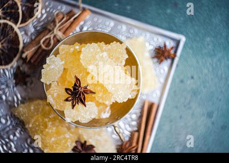 Iranian crystal rock candy and spices in the vintage metal cup Stock Photo