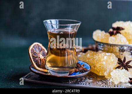 Iranian crystal rock candy and spices in the vintage metal cup Stock Photo