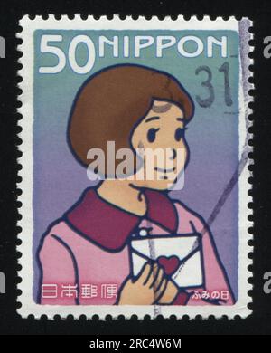 girl in pink dress shows symbols hands Stock Photo - Alamy