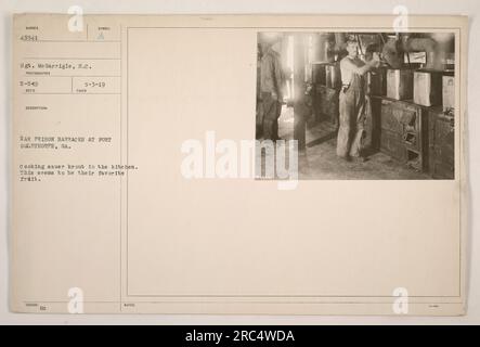 Sgt. Me Garrigle of the South Carolina Army National Guard took this photograph at Fort Oglethorpe, Georgia during World War One. The image shows war prison barracks where prisoners are seen cooking sauerkraut in the kitchen. The caption mentions that sauerkraut seems to be their favorite fruit. The photograph was received and described on May 3, 1919. Stock Photo