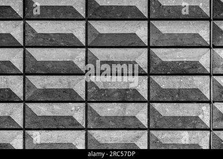 Rectangular bas relief stone tiled blocks close up texture background, textured and stained surface design element Stock Photo