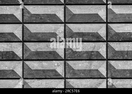 Rectangular bas relief stone tiled blocks close up texture background, textured and stained surface design element Stock Photo
