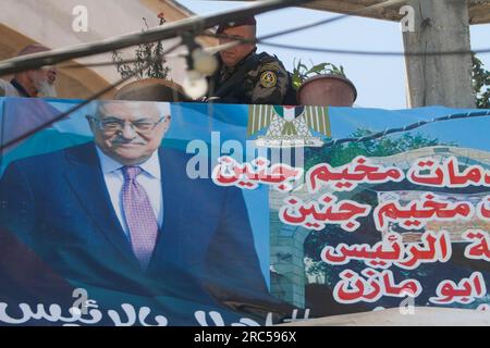 Jenin, Palestine. 12th July, 2023. A banner with Palestinian President Mahmoud Abbas hangs in the alleys of the Jenin refugee camp, ahead of his visit to the West Bank city of Jenin. Credit: SOPA Images Limited/Alamy Live News Stock Photo