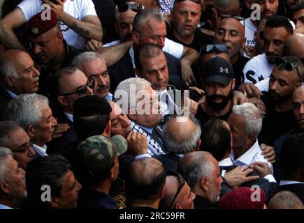 Jenin, Palestine. 12th July, 2023. Palestinian president Mahmud Abbas (C) arrives to the Jenin camp, north of the occupied West Bank in a landmark visit, a week after the largest Israeli raid there in years. (Photo by Nasser Ishtayeh/SOPA Images/Sipa USA) Credit: Sipa USA/Alamy Live News Stock Photo