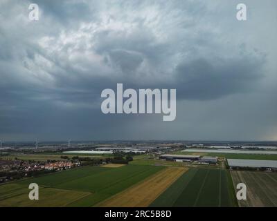 Aerial view of an approaching thunderstorm over an agricultural area in The Netherlands Stock Photo