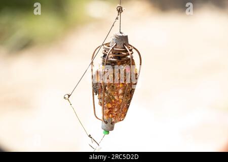 Feeder for feeding fish, fishing tackle with ready-made dressing, fishing tackle Stock Photo