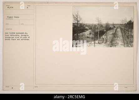 Bird's-eye view of War Prison Barracks #1 at Fort McPherson, Georgia, showing the northern fence and stockade. The photograph was captured during sunset by the Signal Corps, with a total of 45,675 images taken. This image is marked with the 'H Symbol A' and comes with accompanying notes. Stock Photo