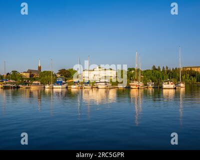 Lake afternoon light on the Martina on Lake Superior with The Best Western Hotel Chequamegon in the background in Ashland Wisconsin USA Stock Photo