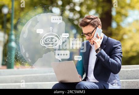 Young guy entrepreneur typing on laptop keyboard, using chatbot Stock Photo