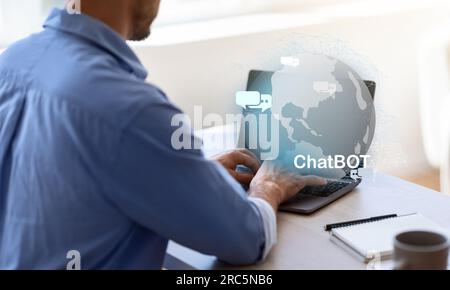 Unrecognizable entrepreneur using chatbot on laptop at office Stock Photo