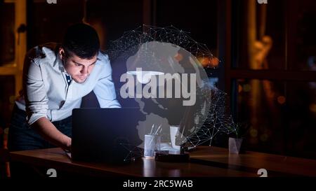 Young man entrepreneur working on laptop, using chatbot Stock Photo