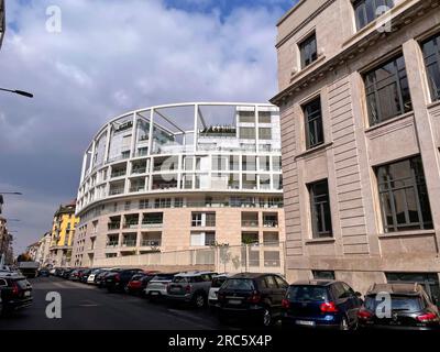 Milan, Italy - March 31: Modern Italian buildings and street view in Milan, the capital of Lombard, region of Italy. Stock Photo