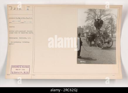 Image Caption: A mobile anti-aircraft searchlight being used by the Engineer Corps during World War I, captured in a photograph taken on April 17, 1918. The photograph was taken by Lieutenant W. C. Pox of the Signal Reserve Corps and received on April 26, 1918. The location is Washington Barracks, D.C. The image was censored and released on May 9, 1918, by the Historical Branch of the War Plans Division. (Notes indicate photograph number 8274 and re-carboning of the image.) Stock Photo