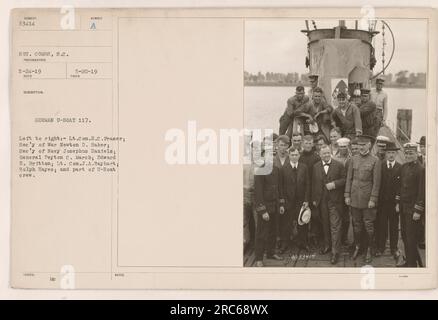 German U-Boat 117 captured by Allied forces during World War One. In the photograph, Lt. Com. H.C. Fraser and U.S. government officials Secretary of War Newton D. Baker and Secretary of the Navy Josephus Daniels can be seen examining the U-Boat. Also present are General Peyton C. March, Edward E. Britton, Lt. Com. J.A. Rayhart, Ralph Hayes, and members of the U-Boat crew. This image was taken by Sgt. Combs on May 24, 1919, with the description and issue number 53414. A copy was given on May 20, 1919. Stock Photo