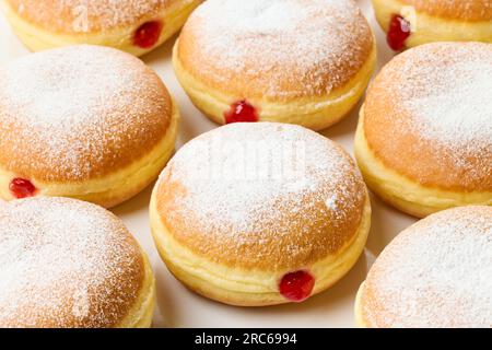 freshly baked jelly donuts background Stock Photo