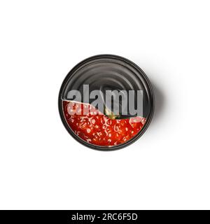 Red salmon caviar in an open black tin can on a white background top view. Useful delicacy seafood, canned fish. Stock Photo