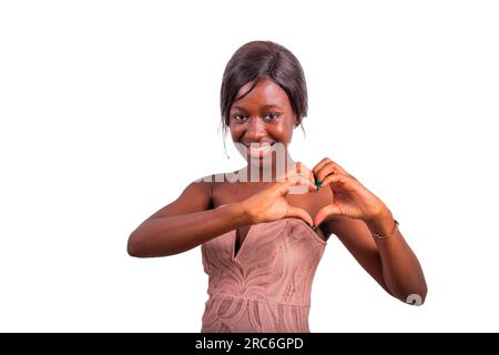 African woman making heart with her hands, studio portrait with white background Stock Photo