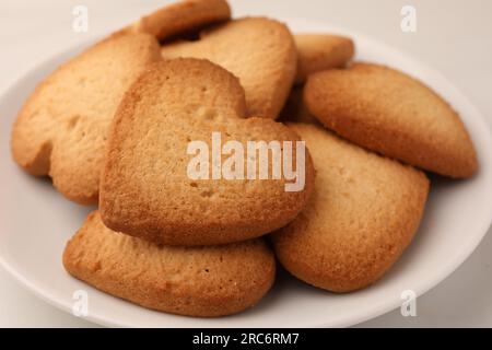Heart shaped Danish butter cookies on plate, closeup Stock Photo