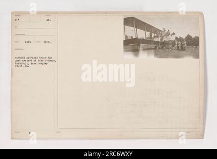 Caproni airplane being transported to Polo Grounds in Washington, D.C. from Langley Field, Virginia. Taken in 1917, this photo shows the arrival of the airplane at its new location. Stock Photo