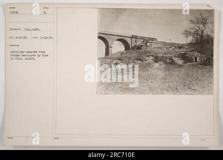 Artillery dugouts near a bridge destroyed by fire in 1914 in Alsace. The photograph, with the identification number 67643, was taken by the Signal Corps on March 13, 1919. The description indicates the symbol E and emphasizes the proximity of the dugouts to the destroyed bridge. Notes inform that the photograph was issued undenoted with 'C'. Please note: We could not find reference to the acronym 'THA' mentioned in the provided information. If there is any information missing or additional details required, please let us know and we will provide it. Stock Photo