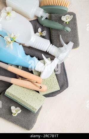 Brushes, sponges, rubber gloves and natural cleaning products. Eco-friendly cleaning products on a white background. Top view. Stock Photo