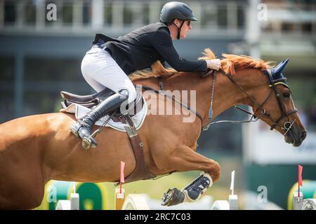 Daniel Coyle of Ireland competes in the Rolex North American Grand Prix at Spruce Meadows. Stock Photo