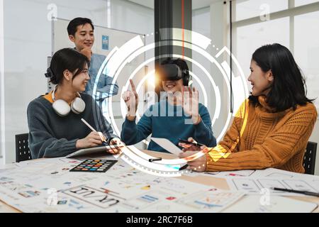 Creative teamwork using high tech headset for virtual reality. Team of ux developer and ui designer brainstorming interface Stock Photo